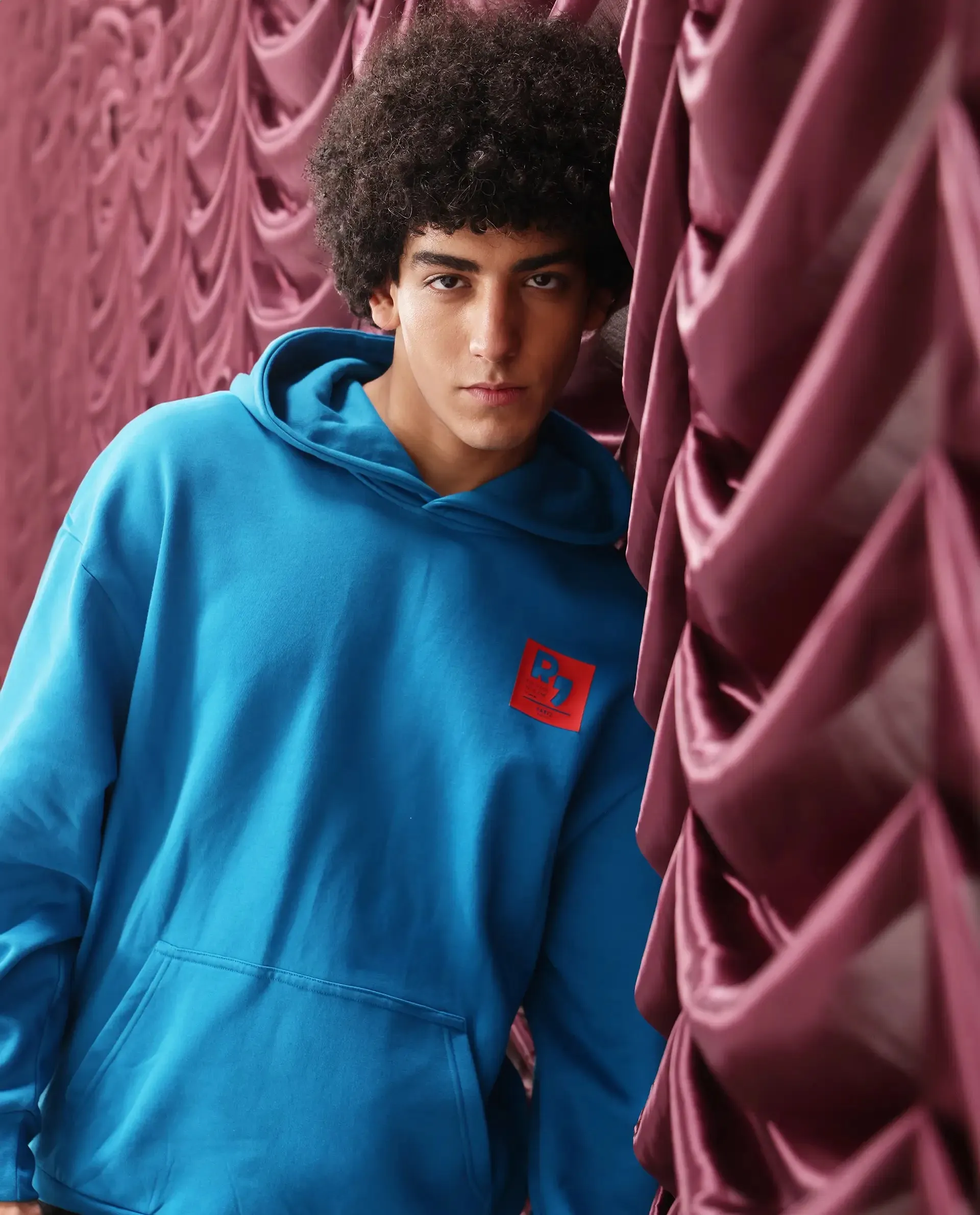 Rare Rabbit Men Dary Flouroscent Blue Cotton Polyester Fabric Full Sleeve Crew Neck Boxy Fit Puff Print Hooded Sweatshirt